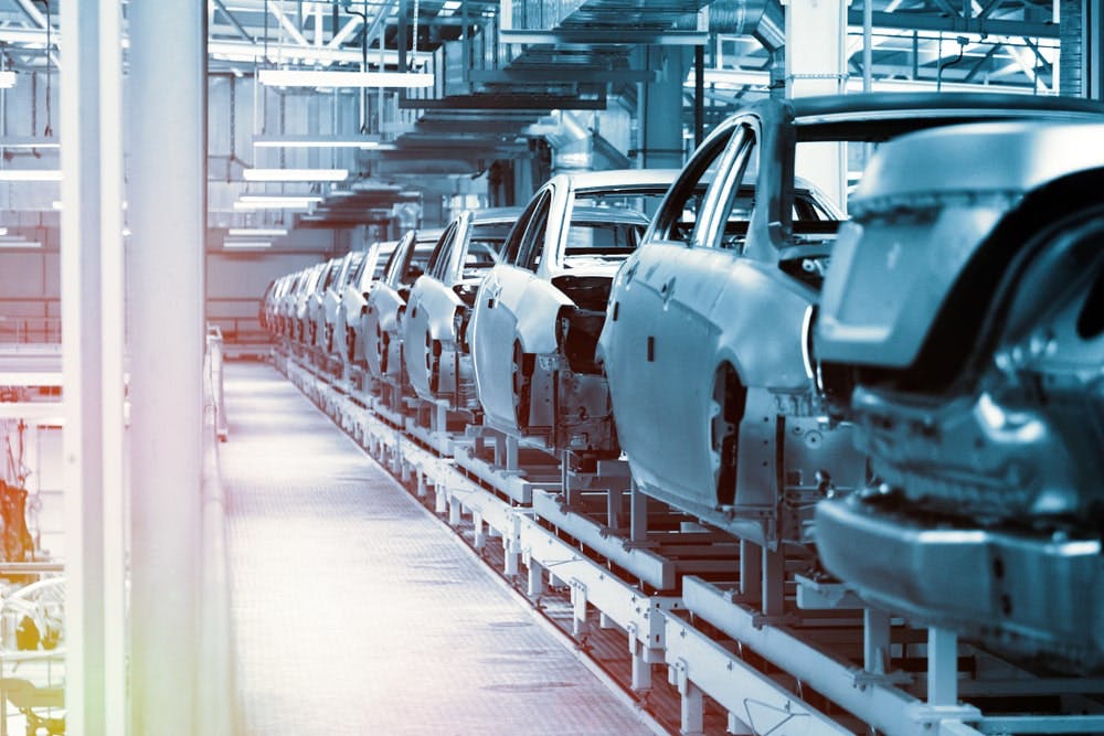 Automobile bodies in an assembly line. Image credit: Jasen Wright/Shutterstock.com. 