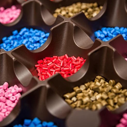 Polymeric dyed plastic pellets. Image Credit: Shutterstock.com/Mr_Mrs_Marcha