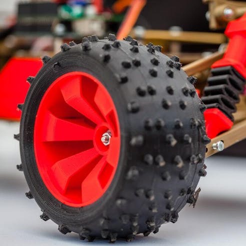 3D printed toy car with rubber tires. Image Credit: Shutterstock.com/marius narcis popa
